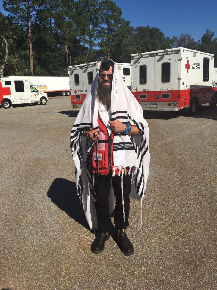 Rabbi Yossi Lipsker wearing tallit, tefillin, and an American Red Cross vest in Savannah, Georgia