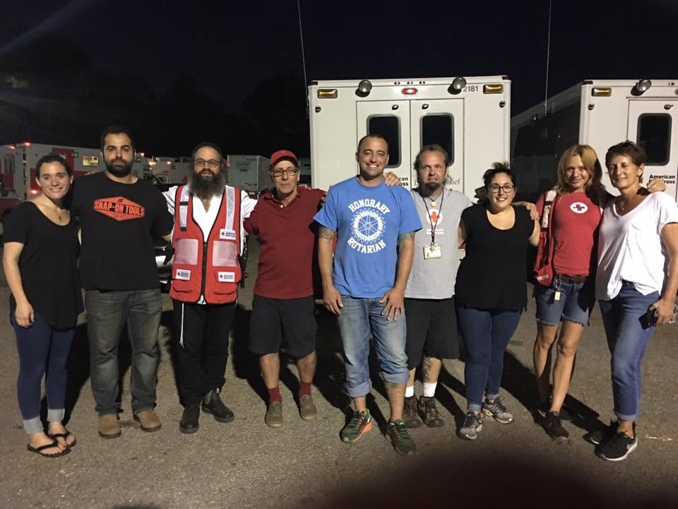Rabbi Yossi Lipsker and 1Mitzvah team in front of Red Cross trucks in Savannah